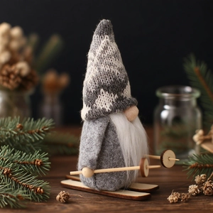Nordic Christmas gnome on wooden skis with grey knit hat and plush beard decoration