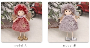 Detailed view of red and grey plush Christmas angel dolls with glittery wings and fur outfits