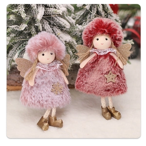 Detail showing plush Christmas angel ornaments with lace collars and sequined wings
