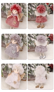 Close-up of plush Christmas angel dolls with lace collars and sequin ornaments