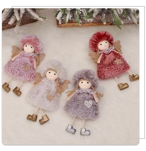 Detail of plush angel dolls in four colors with glittery wings and snowy pine decor