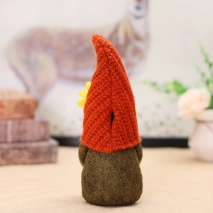 Handmade harvest gnome with orange knit hat and pumpkin decor for autumn home display