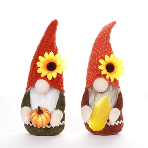 Harvest gnomes set with pumpkin and corn, featuring knitted hats and sunflowers