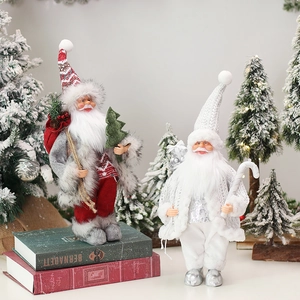 Standing Christmas gnome figures with LED lanterns and gift bags for holiday window display