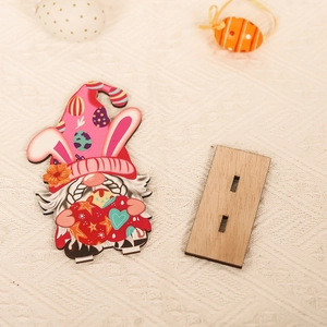 Easter gnome wooden table decoration with bunny ears and colorful egg patterns on wood base