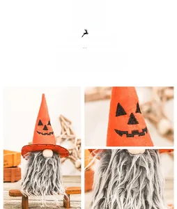 Detail of Halloween gnome featuring orange pointed hat with pumpkin face and grey beard