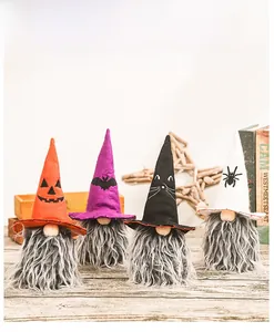 Detail of four Halloween gnomes featuring themed hats with pumpkins and bats patterns