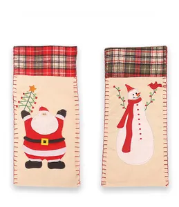 Detail of Christmas wine bottle covers with Santa and snowman burlap appliques