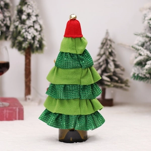 Christmas tree wine bottle cover in red and green sequins with a golden bell topper