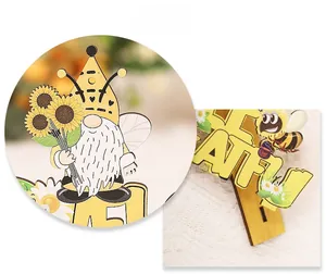 Detail view of wooden bee gnome tabletop decor featuring Bee Grateful text and sunflower