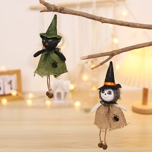 Halloween burlap ghost and black cat doll ornaments hanging on rustic branches