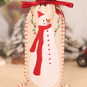 Christmas burlap wine bottle cover with snowman embroidery and red ribbon tie