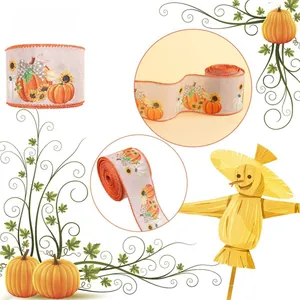 Close-up of fall ribbon featuring pumpkins and sunflowers on burlap texture for autumn decor