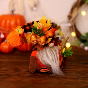 Fall Harvest gnome with orange plaid hat and maple leaf on warm rustic wood table
