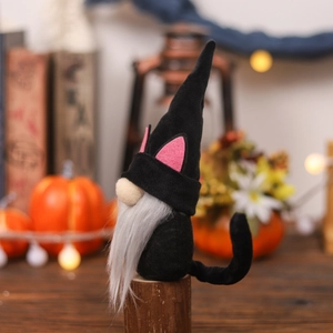 Halloween black cat gnome plush with long whiskers and tail on a rustic wooden stand