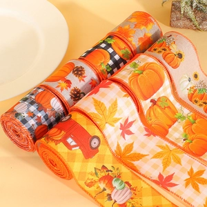 Fall decorative pumpkin ribbons with maple leaves and vintage truck for harvest season