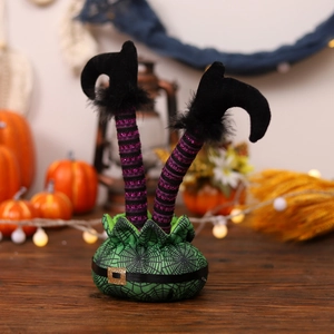 Halloween elf legs decoration in green cauldron with purple striped stockings and boots
