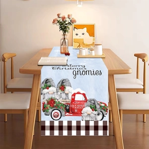 Christmas table runner with gnomes and red truck design on a light blue background