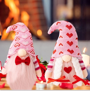 Detailed view of handmade Valentine gnomes with pink hats and red heart decorations