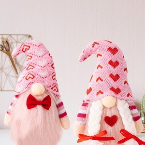 Pink knit Valentine gnomes set with red heart patterns for home holiday decorations