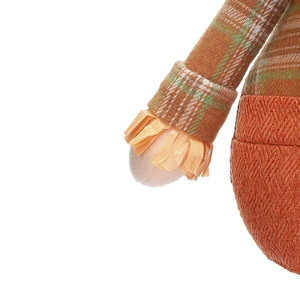 Close-up of harvest scarecrow doll featuring orange burlap fabric and plaid sleeve details