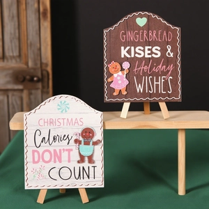 Christmas wooden gingerbread man tabletop signs with festive quotes on easel stands