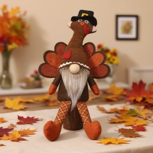 Detail of a Thanksgiving turkey gnome with a black pilgrim hat and colorful maple leaves