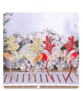Détail de serre-têtes bois de renne pailletés en or et rouge pour fêtes de Noël