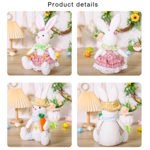 Detail of Easter bunny plush figures wearing pink and yellow checkered outfits with carrots