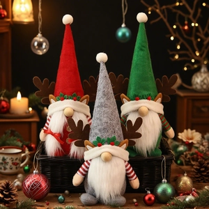 Three-piece Christmas gnome plush set with reindeer antlers on a festive indoor display