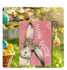 Close-up of Easter garden flag with realistic bunny print on pink linen in sunny garden