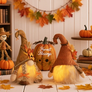 Lighted fall harvest gnomes with sunflowers and maple leaves for home tabletop decor