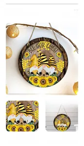 Detail view of Bee Gnomes round hanging sign with Bee Our Guest text and sunflowers