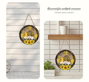 Detail of Bee Our Guest gnome decorative hanging round sign with rustic rope and sunflowers