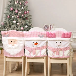 Detailed close-up of pink 3D Christmas chair covers with Santa and snowman motifs