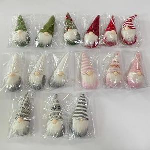 Detailed set of 15 handmade knitted Christmas gnomes with colorful hats and white beards