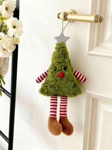 Detail of plush Christmas tree ornament with striped legs hanging on a door handle