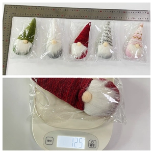 Set of five colorful Christmas gnome ornaments with weight and size measurement tools