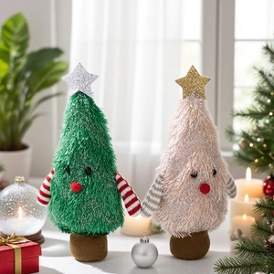 Close-up of knit Christmas tree plush dolls with festive striped arms and star tops