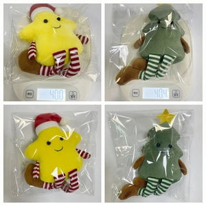 Detailed scale view and packaging of plush Christmas star doll with long striped legs