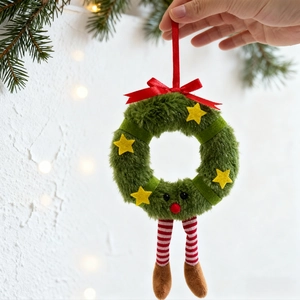 Christmas plush wreath ornament with green faux fur, red bow and striped hanging legs