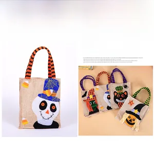 Detailed close-up of burlap Halloween candy bags with 3D felt skull and witch characters