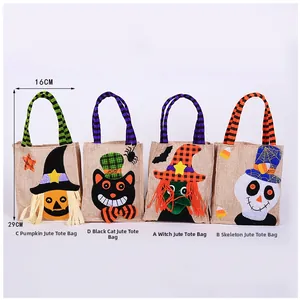 Detail of Halloween burlap candy bags with size 16cm by 29cm and various cartoon motifs