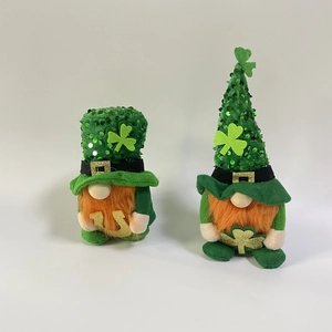 Close-up of St. Patrick's Day gnomes with sequin hats and lucky shamrock symbols
