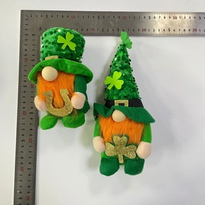 Detailed scale measurement of two green St. Patrick's Day gnomes with sequins