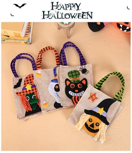Detailed view of 4-piece Halloween burlap candy bags with ghost and pumpkin designs