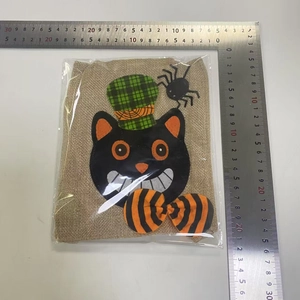 Detail showing Halloween burlap gift bag dimensions with black cat and spider design