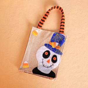 Halloween burlap treat bag with cute ghost pattern and orange striped handle for kids