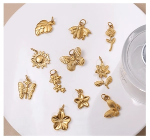 Set of 11 gold stainless steel nature charms with bee butterfly and floral motifs