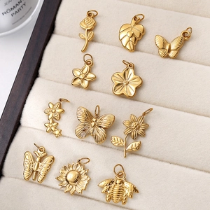 Polished 18K gold plated stainless steel pendants featuring butterfly and flower motifs